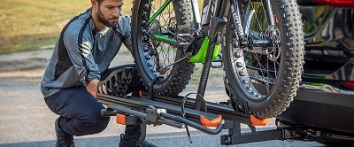 A picture of a bicycle mounted on a trailer hitch