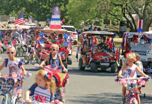 A picture of an Independence Day parade at Jellystone Parks.