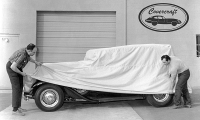 A picture of Covercraft founder Bob Lichtmann putting a cover over a vehicle in the 1960s