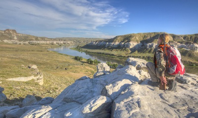 A hunter is pictured on rocks at the Upper Missouri River in Montana