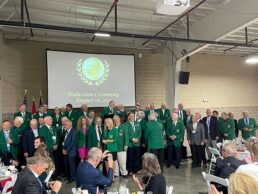 Inductees from the Classes of 2020 and 2021 join the stage at the RV/MH Hall of Fame induction dinner ceremony.