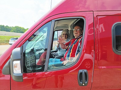 A picture of contest winners Eddie and Joyce Hightower in their Winnebago Solis 59P