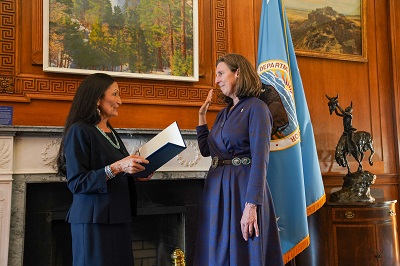 A picture of Martha Williams being sworn in as Fish and Wildlife Services director by Interior Secretary Deb Haaland