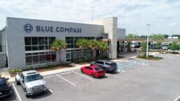 A picture of a Blue Compass RV dealership.