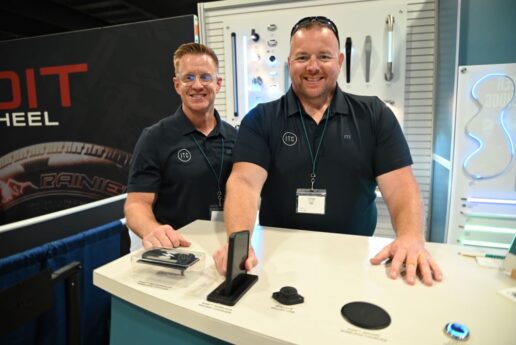 A picture of Darryl Lanier, ITC West Coast account manager (L) and Jason Huxford, Specialty Vehicles regional manager (R) displaying the Rise Wireless Pocket Charger.