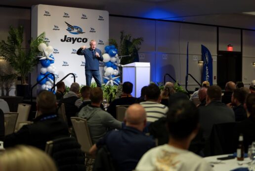 A picture of Jayco President and CEO Ken Walters speaking at Jayco's 2024 dealer training graduation reception.