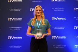 A picture of Star Brite Director of Sales RV & Automotive Liz White holds Star Brite's 2024 Supplier of the Year Award at the RV Aftermarket Conference.