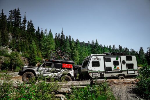 A picture of a Ford Bronco towing a No Boundaries travel trailer in the Off Road Travel TV series.