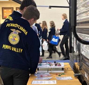 A picture of Future Farmers of America (FFA) members at the RV Technical Institutes booth during the FFA Convention.