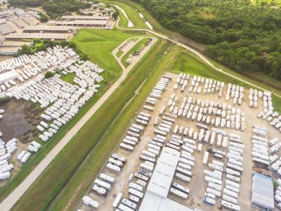 A picture of an RV storage lot from the air with hundreds of RVs including trailers and motorhomes