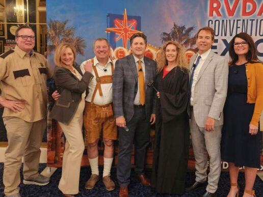 A picture of the Super Lawyers Mock Trial Cast at the 2024 RVDA Convention/Expo. (L to R) Brett Richardson, RVDA director of legal affairs (Bailiff); Jane Saxon, CBIZ managing director (Olga Doutt); Jim Ganther, Mosiac Compliance Services president (Sly Doutt); Dave Thomas, Keystone RV general counsel (Defense Attorney Dewey Billum); Debbie Brunoforte, Camper's Inn RV, Pheonix President (Judge); Harold Oehler, Oehler Mediation and Training (Lester Polyester); and Tobi Conroy, Thor Motor Coach consumer affairs liaison (Service Manager Toby Wan Kenobi).