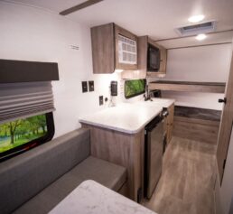 A picture of Gulf Stream Coach's Trail Boss 140BH travel trailer interior.