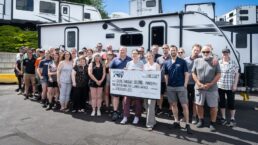 A picture of Voyager RV's donation check to the Central Okanagan Food Bank.