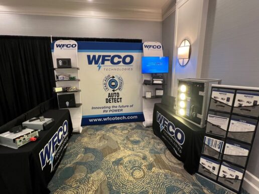 A picture of WFCO Technologies' booth displaying Power Pro replacement kits and 5300 Series inverters.