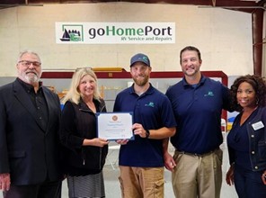 A picture of the goHomePort team accepting their congressional certificate.