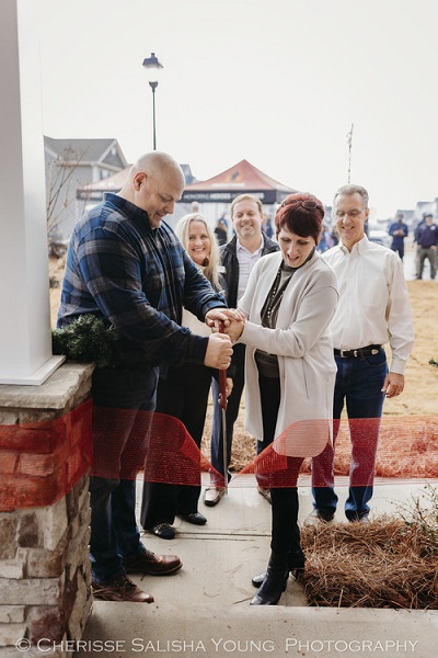 A picture of Veteran Brian Cassidy and family entering their new Finally Home abode