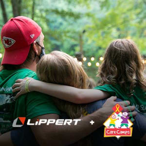 A picture of Care Camps Kids hugging each other with the Lippert log