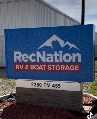 A picture of a Rec Nation sign in front of a storage facility