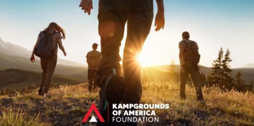 A picture of the KOA Foundation Image showing people outside walking against setting sun