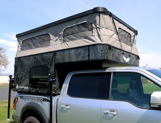 A picture of a Soaring Eagle Pop Top Camper deployed on a Raptor truck