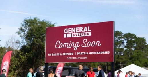 A picture of a sign at the groundbreaking of a new General RV dealership store in Salisbury, North Carolina saying "Coming Soon."