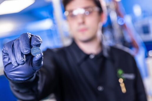 A picture of a man holding up a lithium battery cell, created using recycled lithium batteries and proprietary technology.