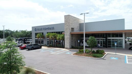 A picture of a Blue Compass RV dealership in Tampa, Florida.