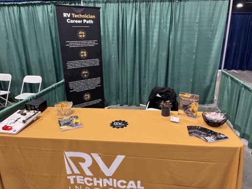 A picture of the unmanned RVTI booth at the Career Quest job fair held at the RV/MH Hall of Fame in Elkhart, Indiana.