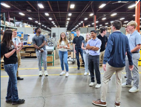 A picture of a group of college interns touring the Ameri-Kart facility.