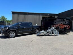 A picture of a U.S. Ranger cargo trailer and the Dream Chopper motorcycle.