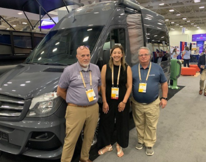 A picture of three RVIA state government affairs staff members in front of a Type B motorhome at the National Conference of State Legislatures in Louisville, Kentucky.