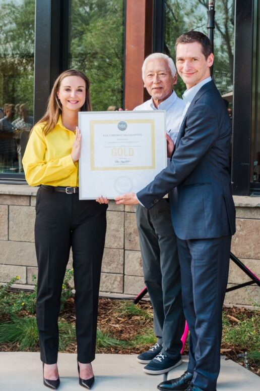 A picture of U.S. Green Building Council President and CEO Peter Templeton (R) awarding KOA President and CEO Toby O'Rourke (L) with the LEED Gold certification.