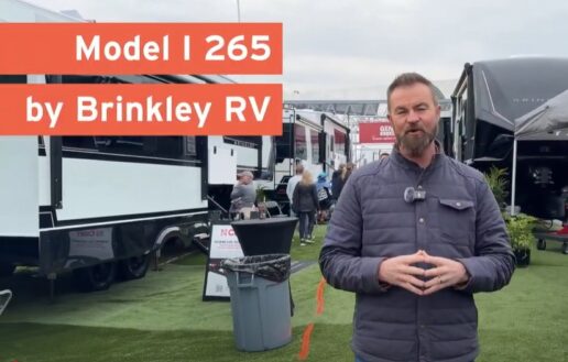 A screenshot of Mike Caudill from Go RVing standing in the Brinkley RV exhibit space at the 2025 Florida RV SuperShow in Tampa.