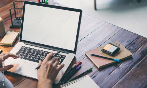 A picture of a person working on a laptop.