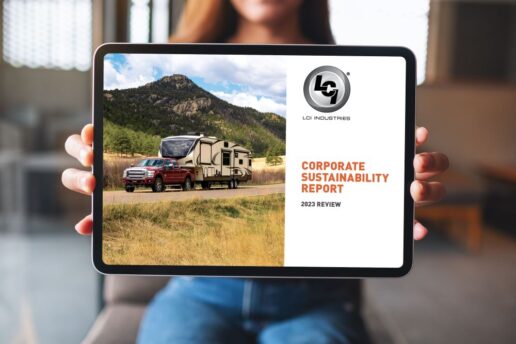 A picture of a woman holding a tablet with Lippert's 2023 Corporate Social Responsibility Report.