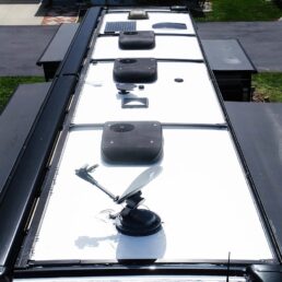 A picture of a Winnebago RV roof after being repaired with Crazy Seal roofing system products.